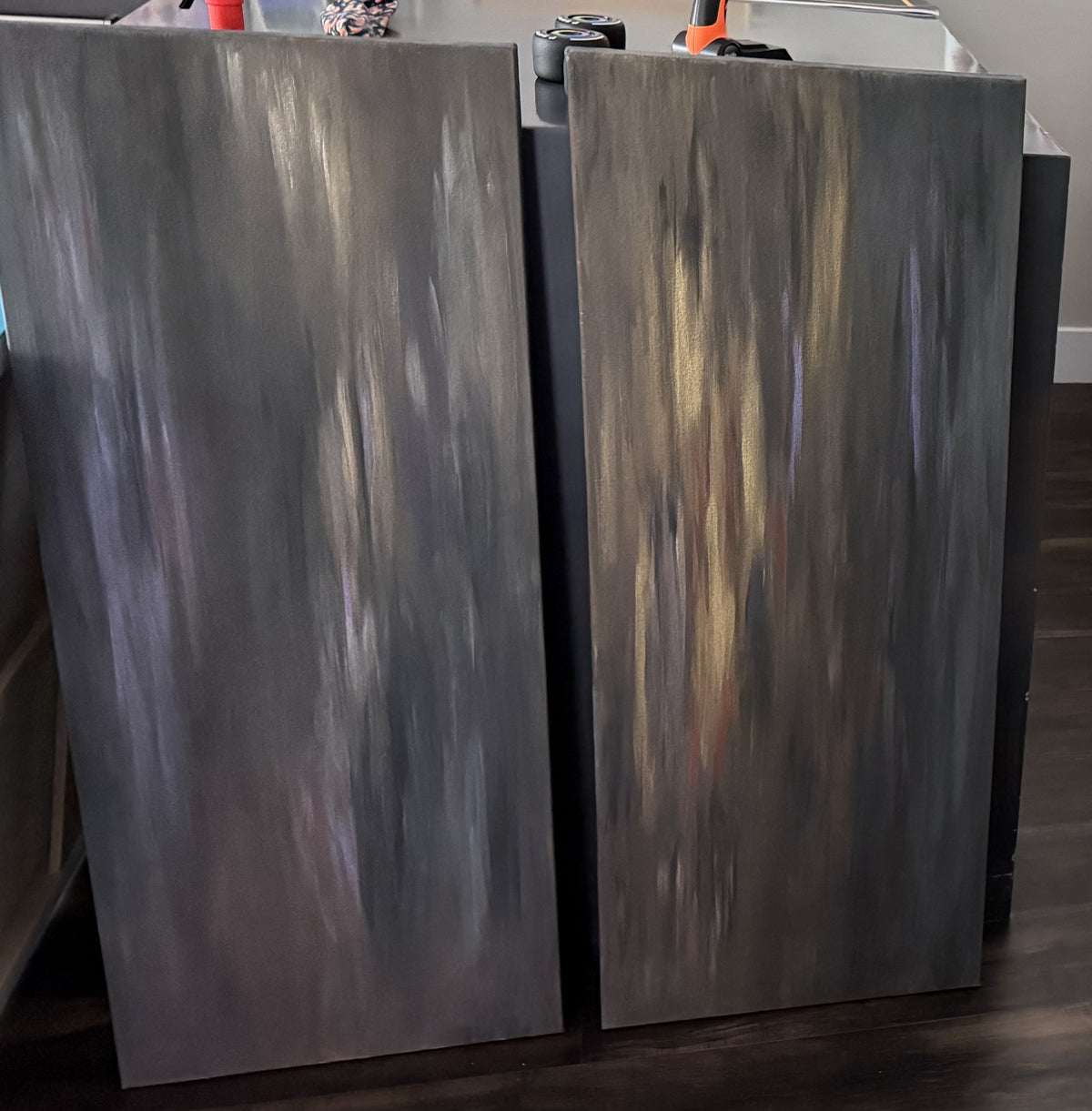 Ember Veil, original abstract painting by Oefy: charcoal and gold vertical strokes across two 16x40 gallery-wrapped canvas panels